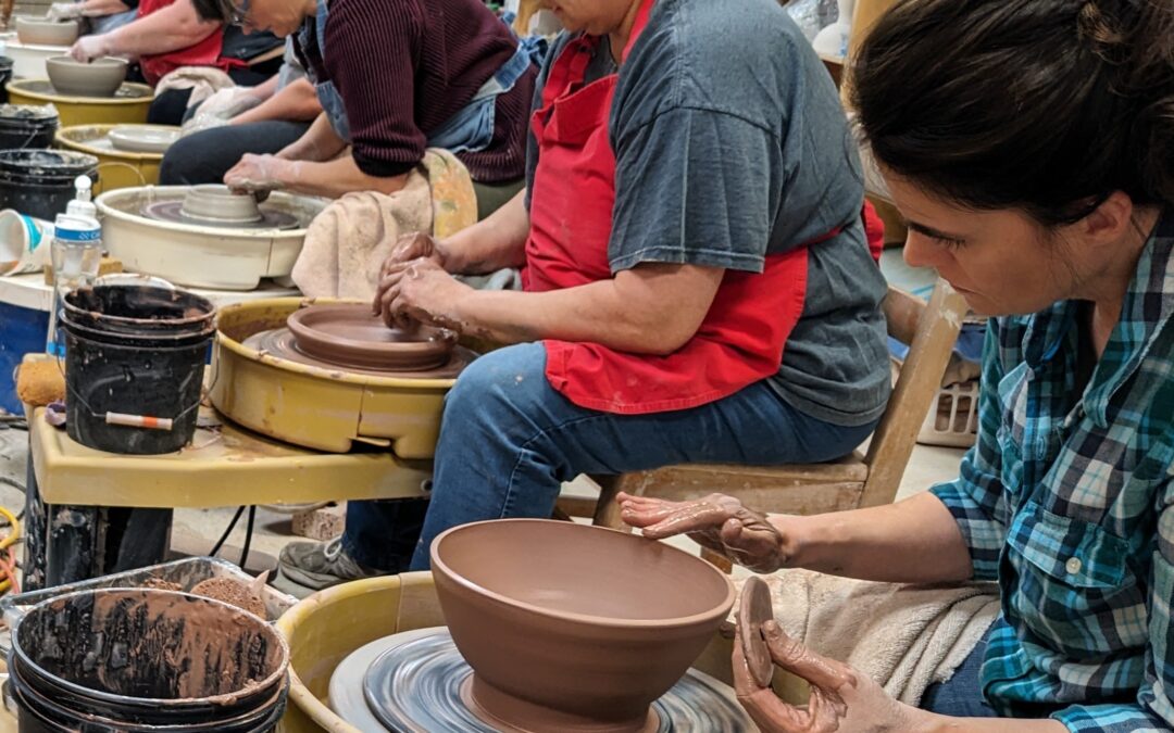 Wheel level 2 students, of all ages, working on throwing larger plates and bowls on the pottery wheel